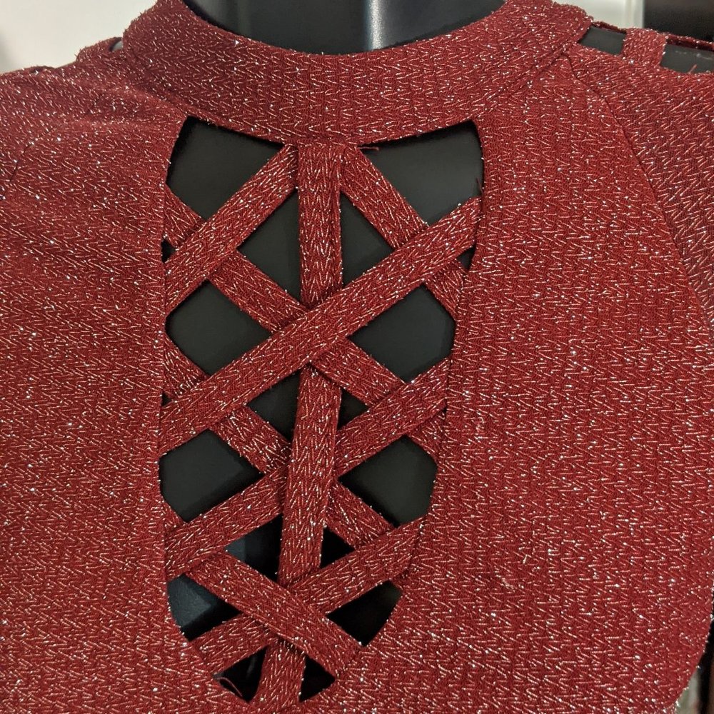 Red glittery cutout dress.